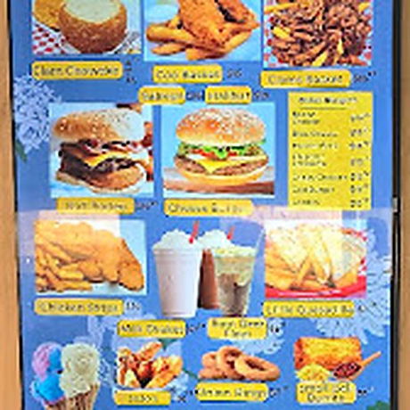 The full illuminated menu board above the counter at Miriam's Little Restaurant